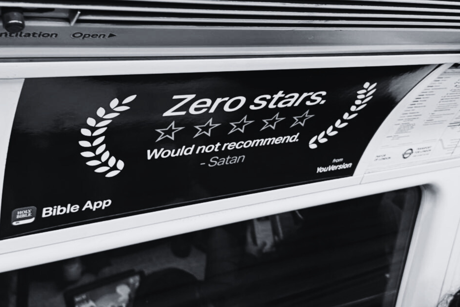 Advert on London Underground showing a review with zero stars.