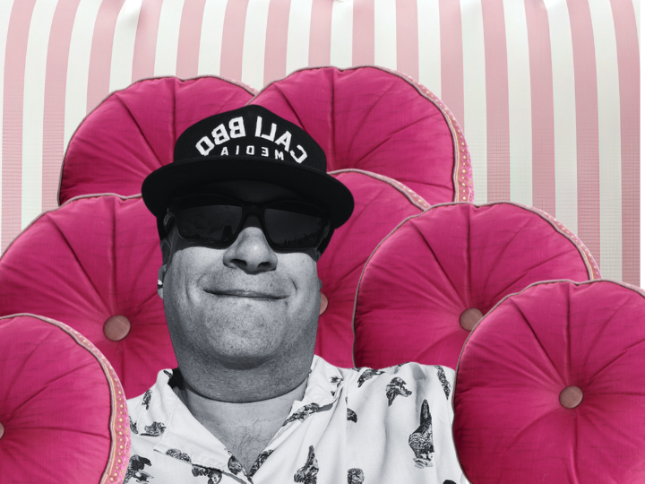 Richard Liverman rests against a pile of pink cushions